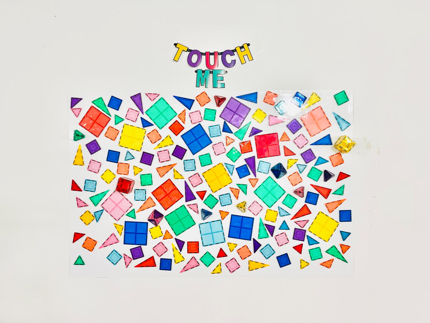  Magnetic Mosaic, toy tiles on whiteboard, 4 x 6 ft.